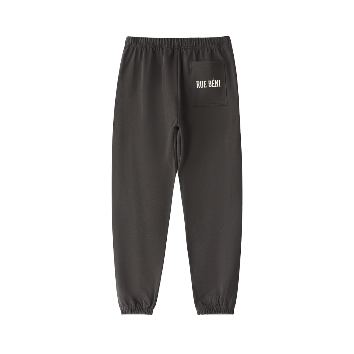 Dark gray jogger pants with gold embroidered graphics, including a peace sign with 'PEACE' and 'WOW' on the lower legs, and a gold crest on the upper thigh pocket, shown against a plain white background.