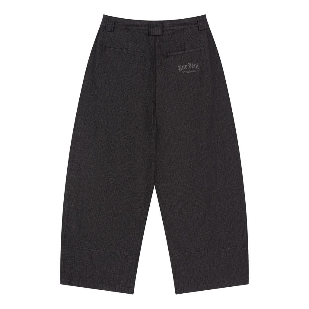 A pair of wide-leg cropped trousers in a dark charcoal gray and black textured fabric, shown flat against a solid white background. A small embroidered logo is visible on the upper right thigh.
