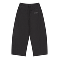 A pair of wide-leg cropped trousers in a dark charcoal gray and black textured fabric, shown flat against a solid white background. A small embroidered logo is visible on the upper right thigh.