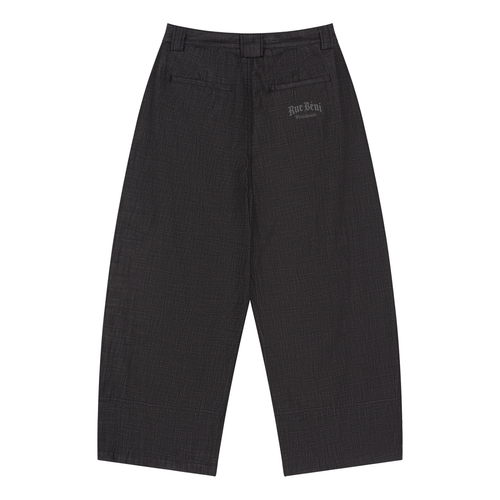 A pair of wide-leg cropped trousers in a dark charcoal gray and black textured fabric, shown flat against a solid white background. A small embroidered logo is visible on the upper right thigh.